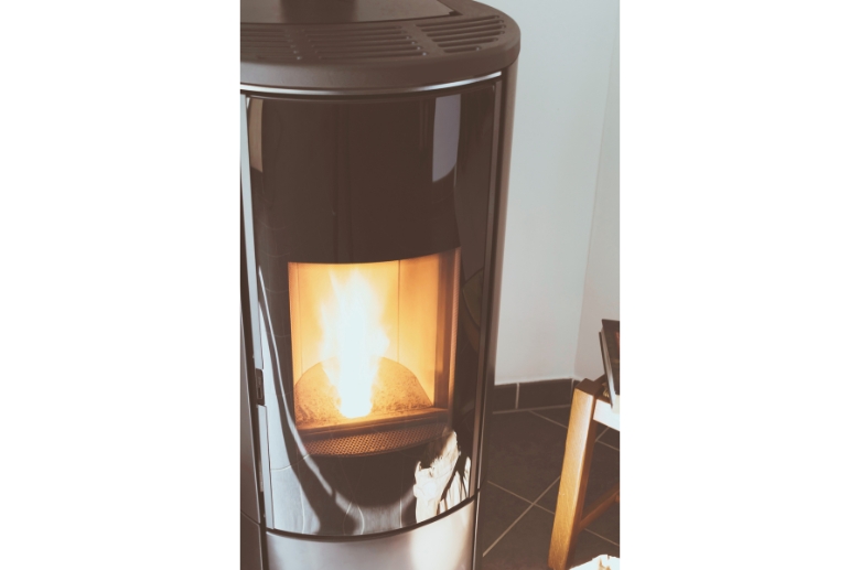 A pellet stove with a large flame.