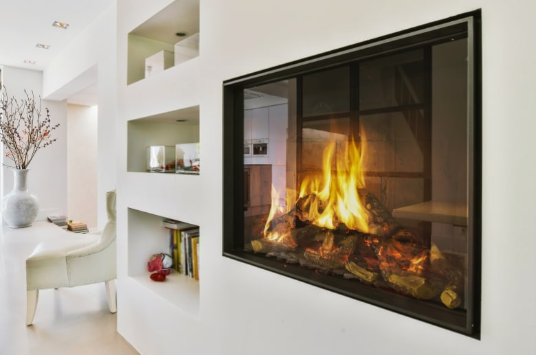 A gas fireplace insert with a clean finish and clear glass.
