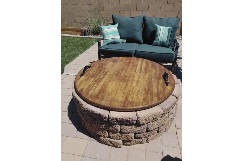 A gas firepit wooden cover.