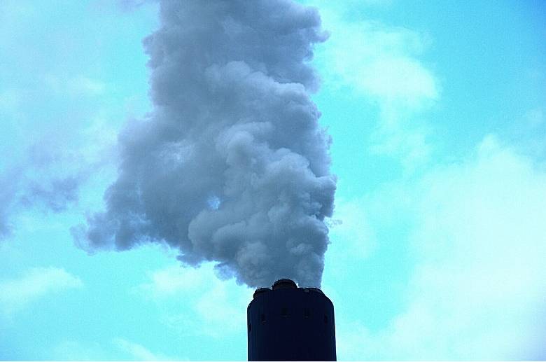 smoke coming out of a stainless steel chimney flue