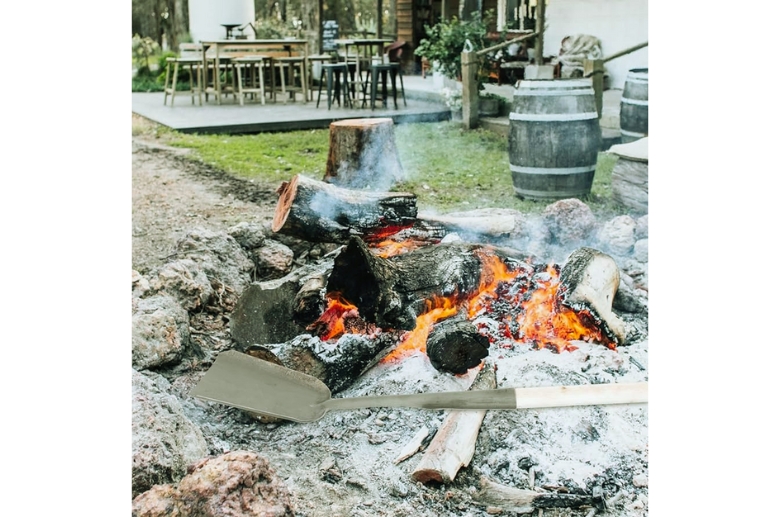 Shovel and fire pit ashes.