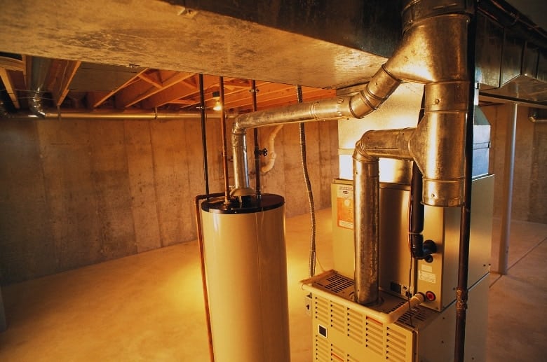 A gas furnace in a basement.