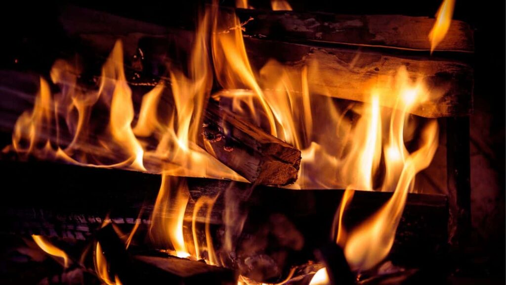 wood burning inside a fireplace