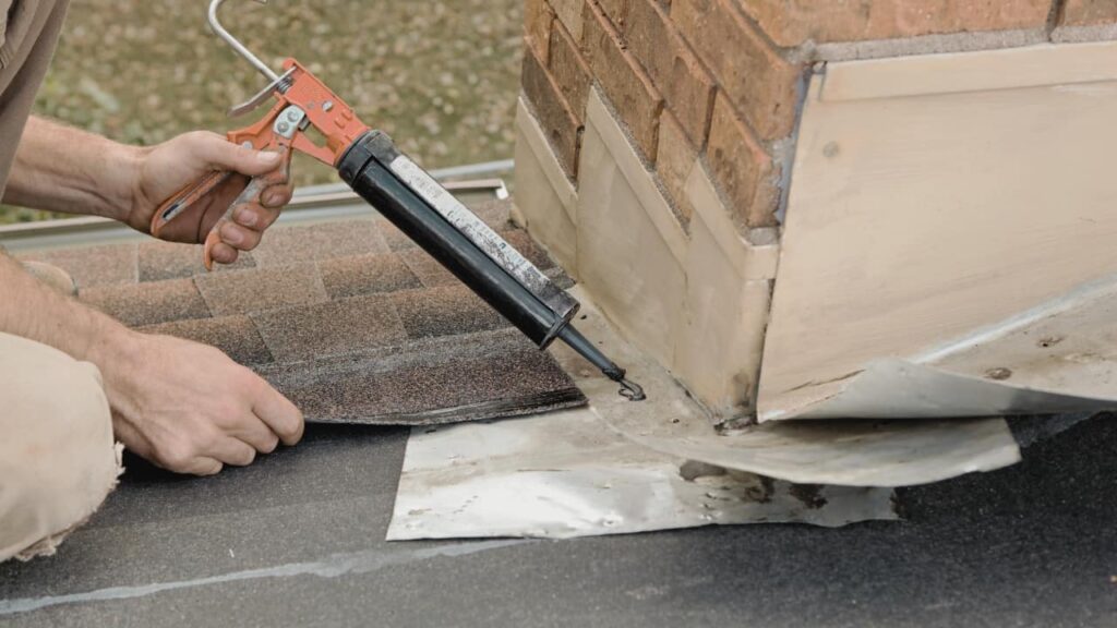 A technician sealing a chimney flue. Know more on how to seal a chiney flue.