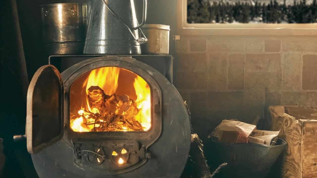 A vintage wood burning stove. Learn how to use an old wood burning stove with this guide.