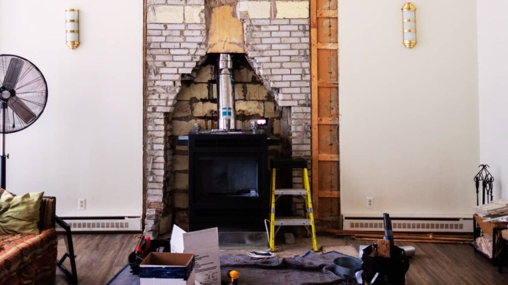 Removing a Fireplace From Middle of House is no easy task. It involves a lot of work like what is shown in the picture.