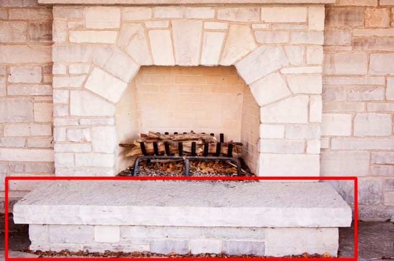 A hearth of an outdoor fireplace.