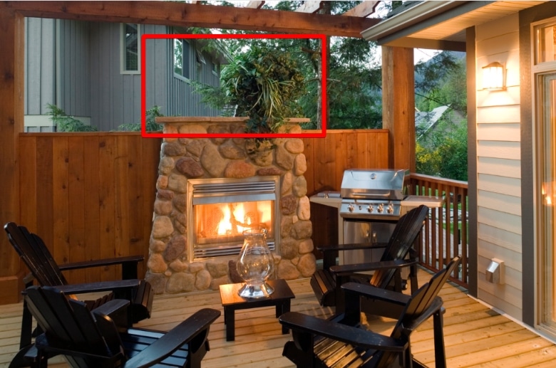 A mantel on an outdoor fireplace.