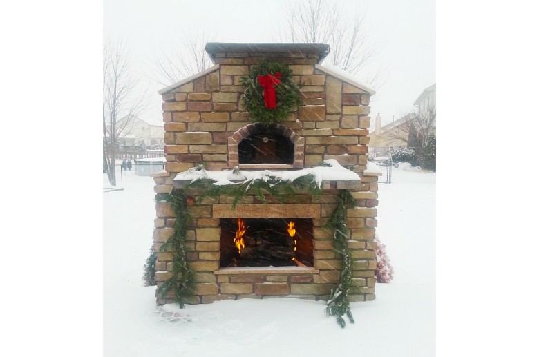 An outdoor fireplace during winter.