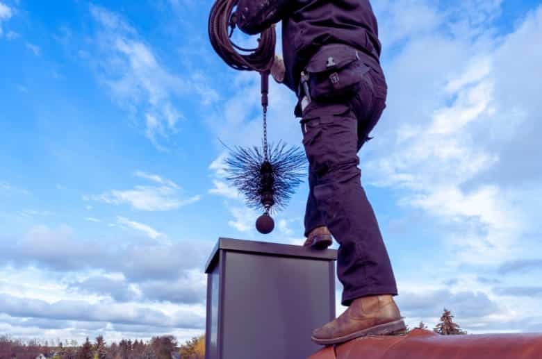 Cleaning the chimney. This is one of the steps on How to Repair a Cracked Chimney Flue.