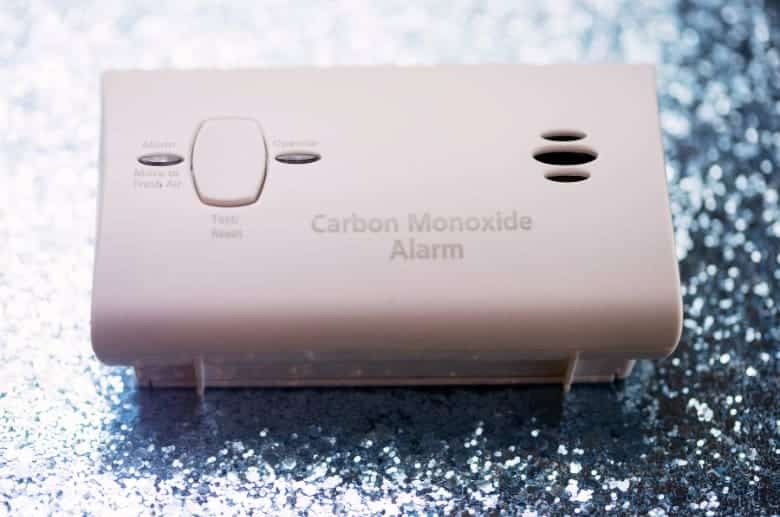 A carbon monoxide alarm. It detects dangerous fumes when there is an installed Wood Stove in Basement.