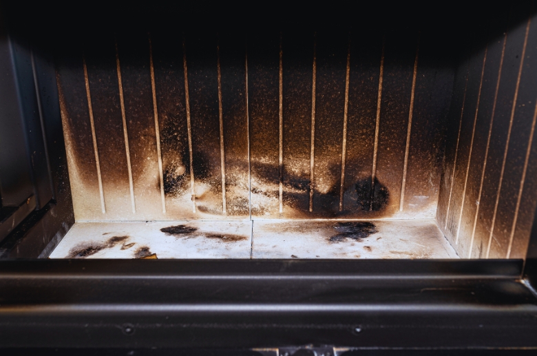 Soot inside the prefabricated fireplace.
