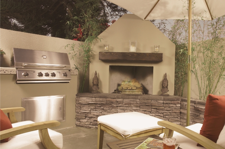 An outdoor fireplace with oven for cooking.