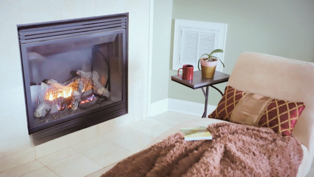 A gas fireplace inside a room. Know what is the most efficient type of gas fireplace.