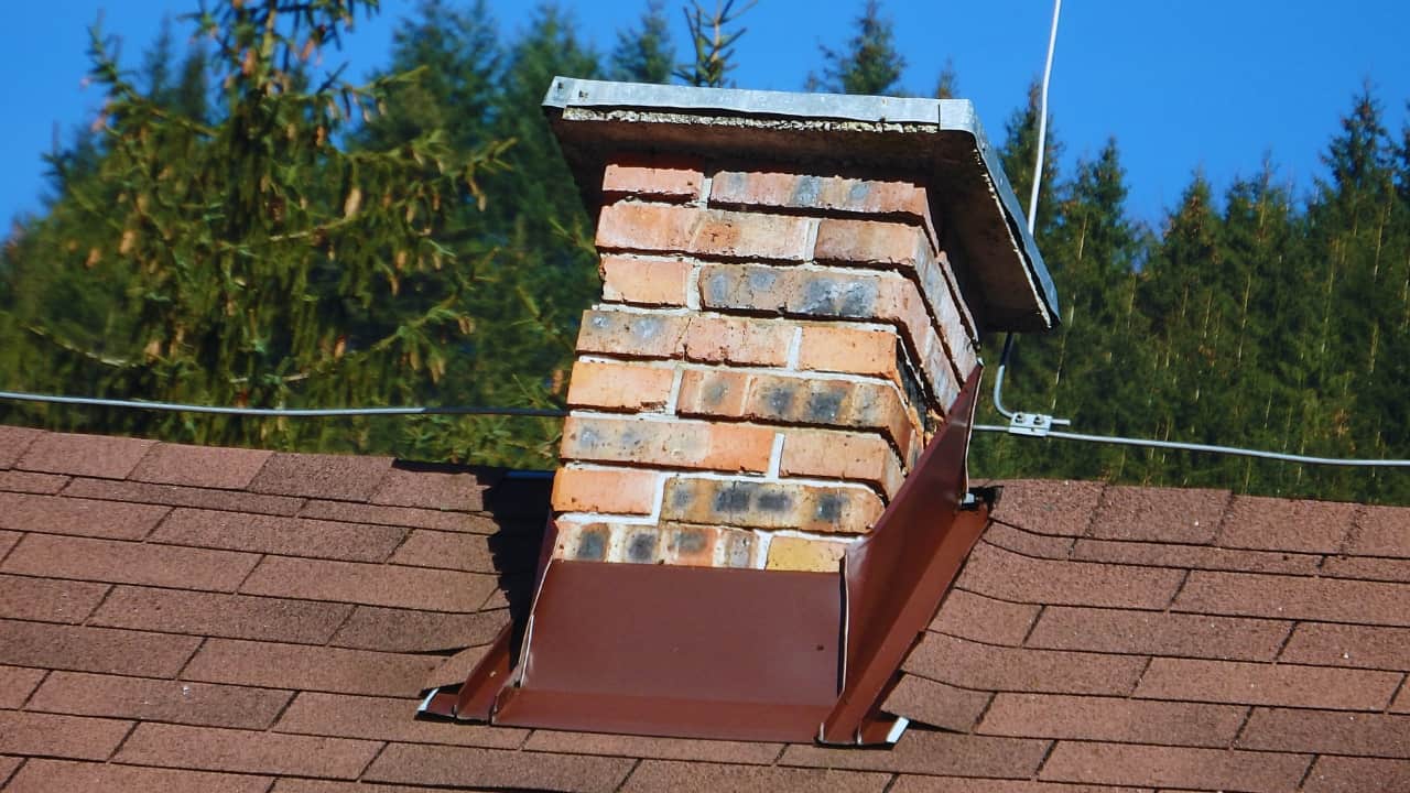 A chimney with new flashing. Determine when should chimney flashing be replaced.