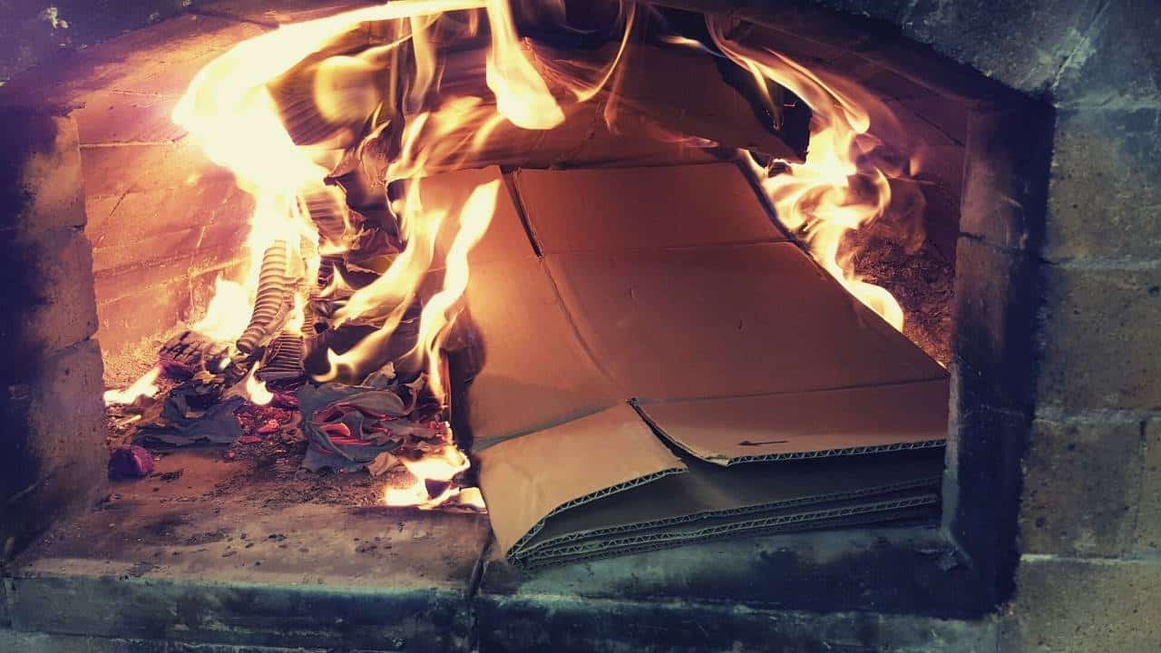 cardboard burning inside a fireplace
