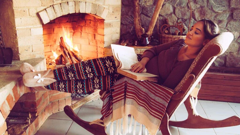 woman feel cold air from fireplace
