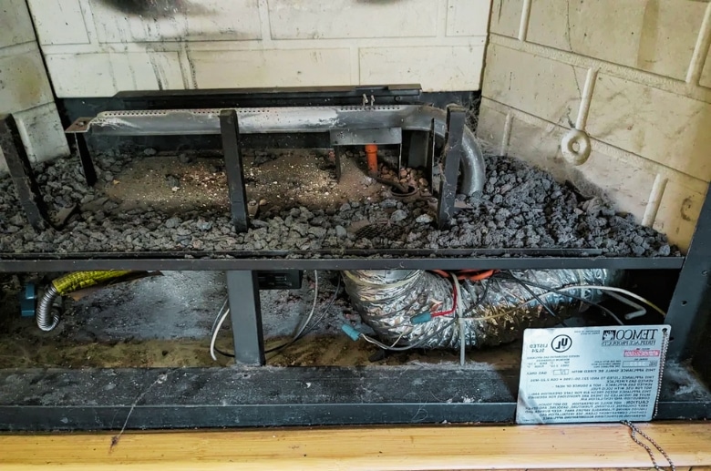 Cleaning a gas fireplace.