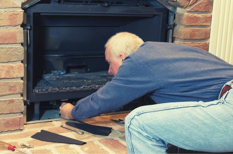 Chimney contractor checking fireplace safety