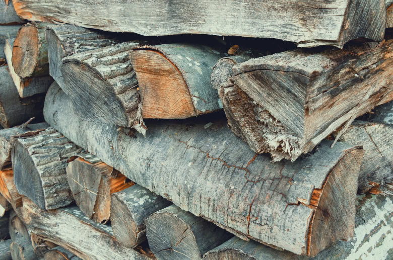 Crisscross stacks of firewood.